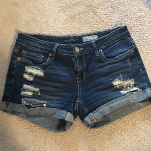 midi length dark denim shorts. Size 4